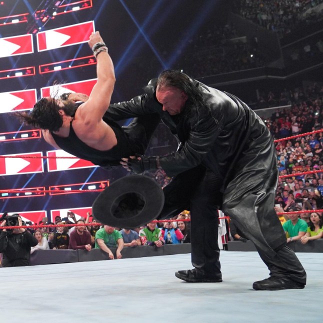 The Undertaker chokeslams Elias on WWE Raw